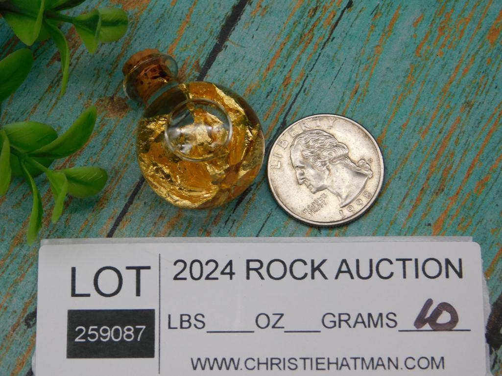 GOLD FLAKES IN BOTTLE