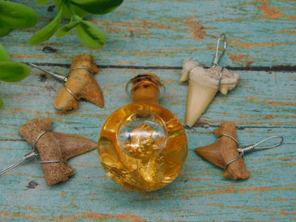 SHARK TEETH PENDANTS AND GOLD FLAKES IN BOTTLE